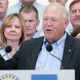 GM CEO looks on at then-UAW President Dennis Williams.